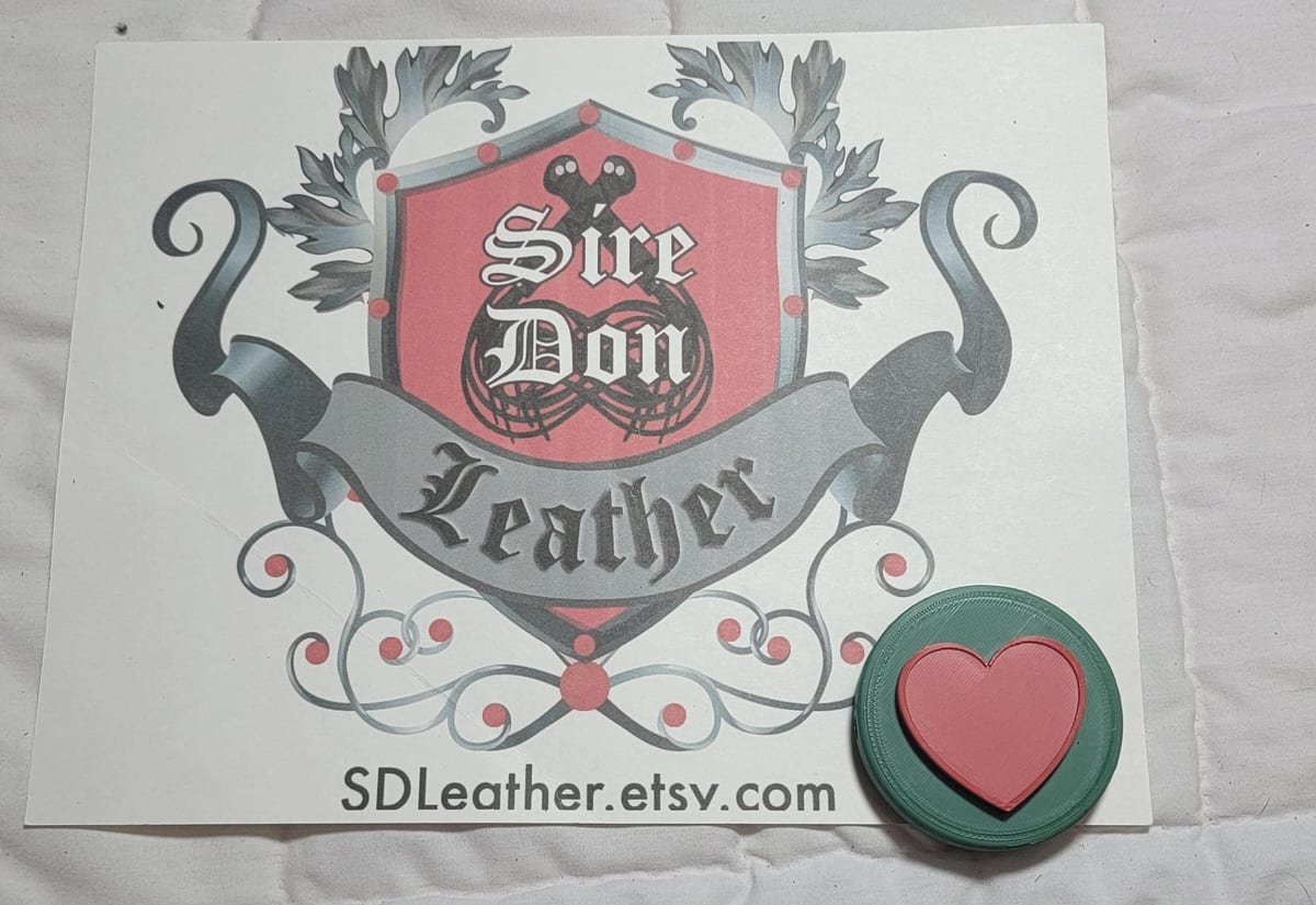 Evil_Stick Cover, Green_Red Heart---Mature Content — photograph 1