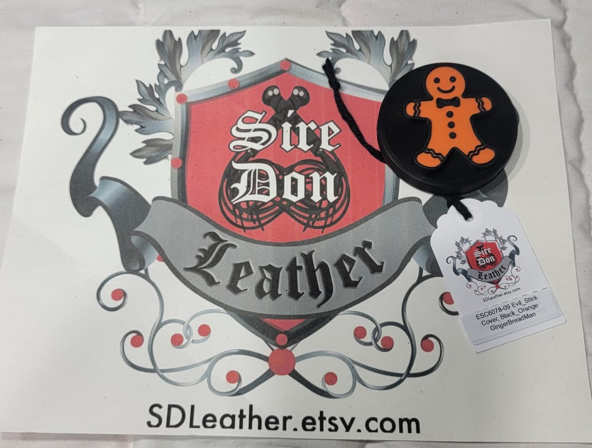 Evil_Stick Cover, Black_Orange GingerBreadMan---Mature Content — photograph 1