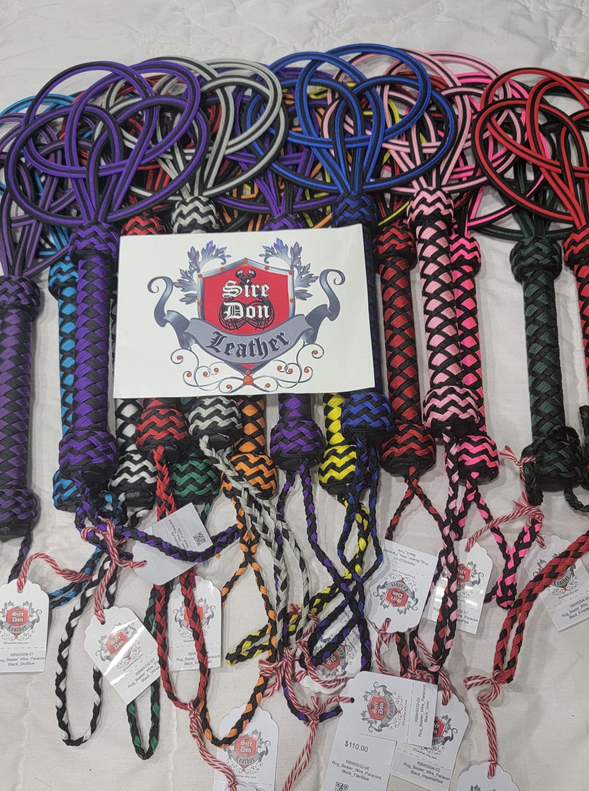 View 3 of 3: Rug_Beater_Wire_Paracord Black_Orange — photograph 3