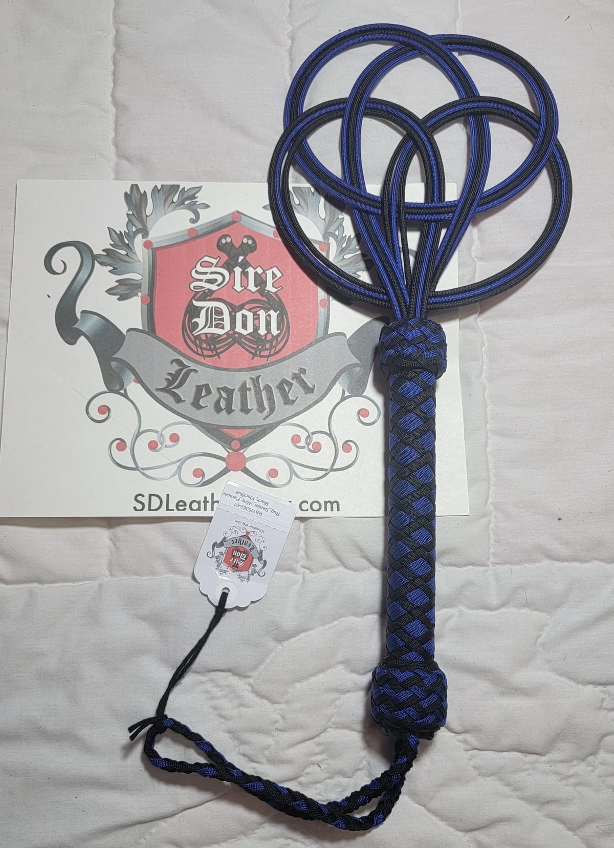 Rug_Beater_Wire_Paracord Black_ElecBlue — photograph 1