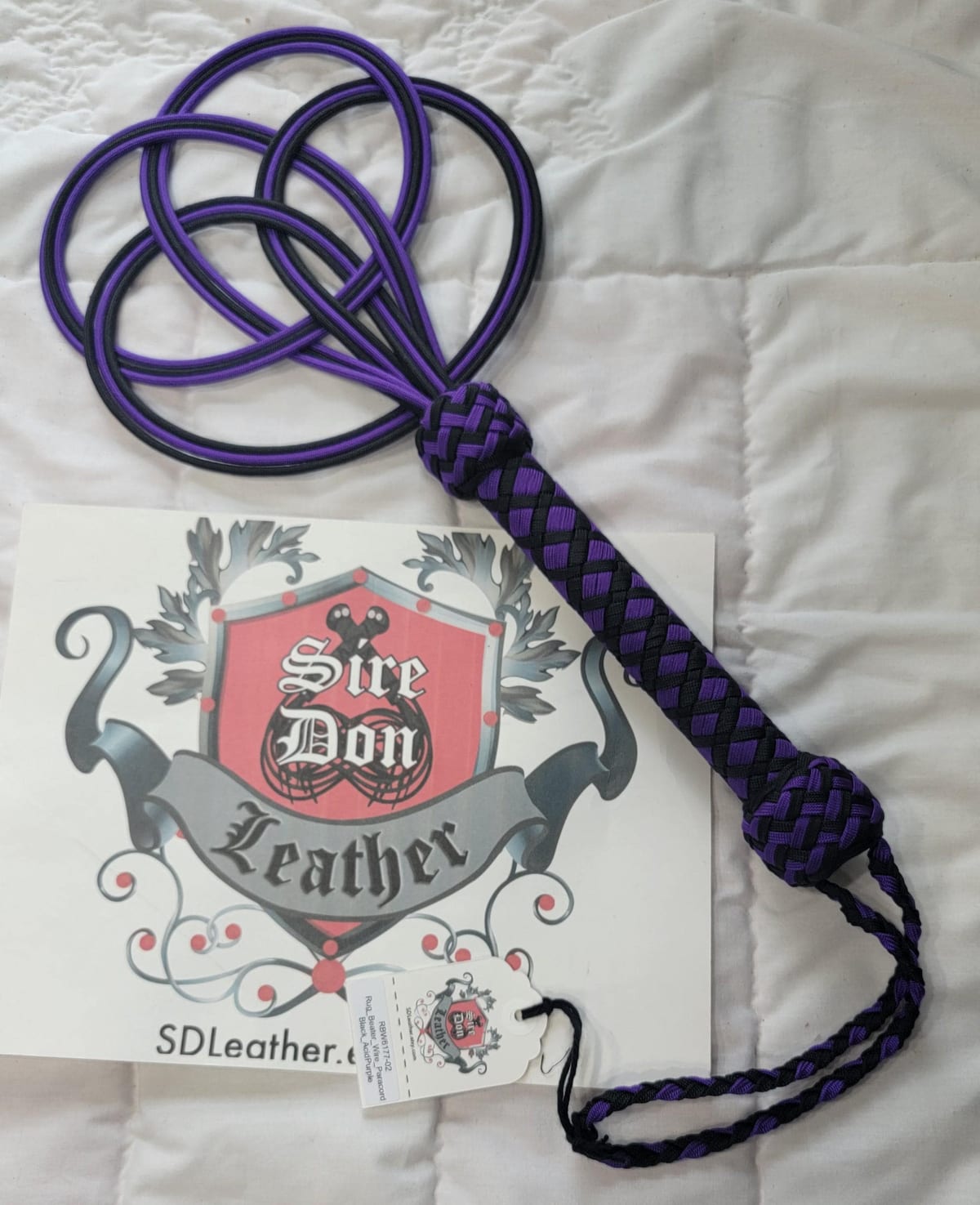 Rug_Beater_Wire_Paracord Black_AcidPurple — photograph 1