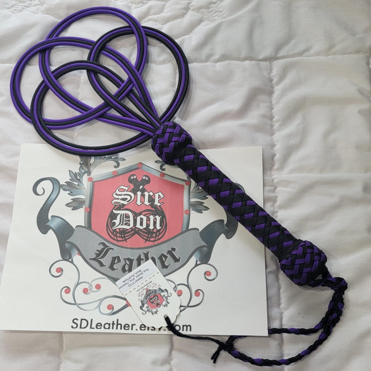 Rug_Beater_Wire_Paracord Black_AcidPurple — photograph 1