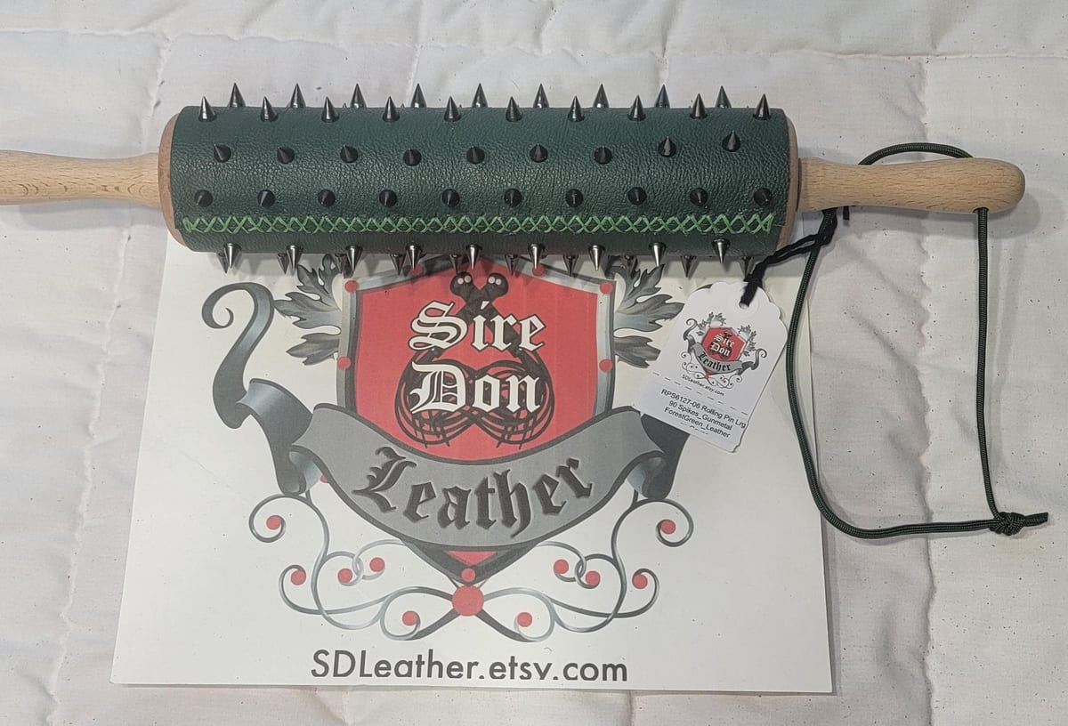 Rolling Pin Lrg 90 Spikes_Gunmetal ForestGreen_Leather w_Cover — photograph 1